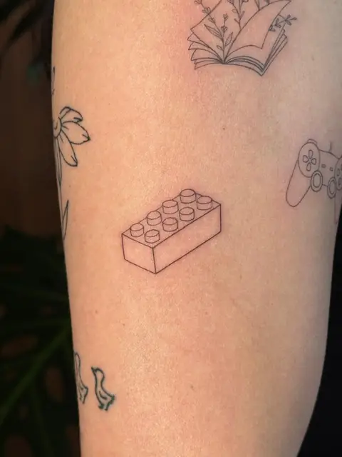 A building brick in fine line — small and precise.